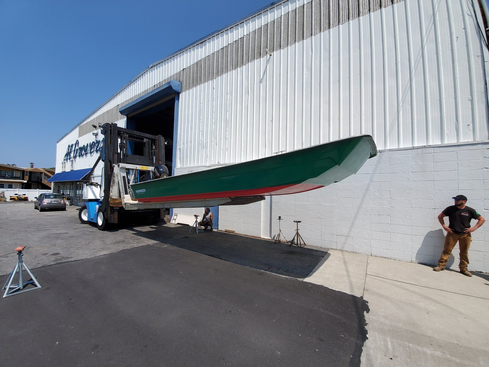 Henriksen Boat Designs shop with a hull coming out